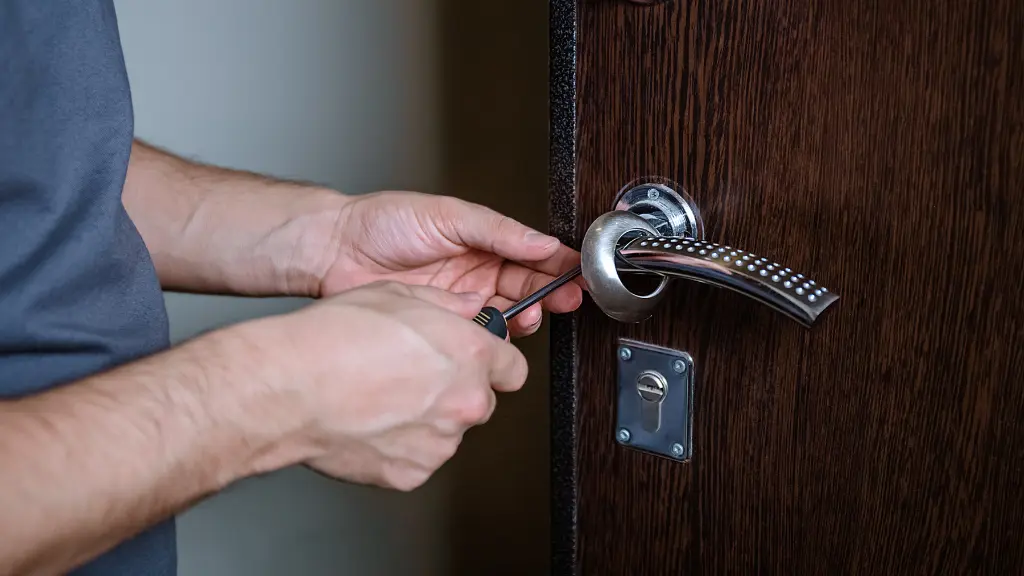 Locksmith replacing door lock to new after losing keys.